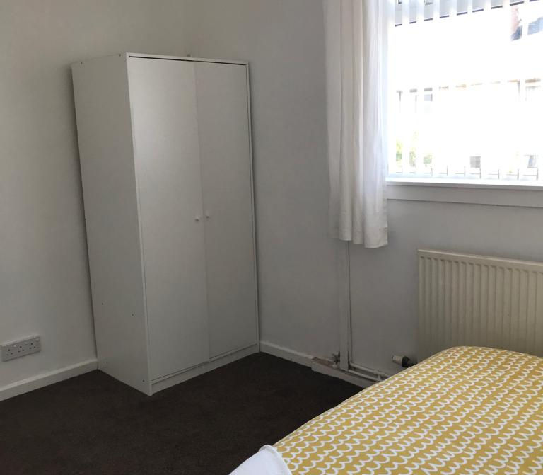 Double bedroom with wardrobe and storage