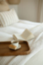 sea haven coffe and a rusk in bed with a book with a view of the beach