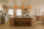 Sea haven luxury modern kitchen with curved kitchen island breakfast counter and bespoke appliances