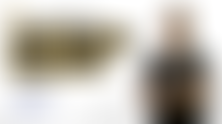 Smiling dentist in black scrubs ( Dr. Sandhu) with text: Parent's Guide to Root Canal in Milk Teeth by Dr. Sandhu. Subscribe button below.