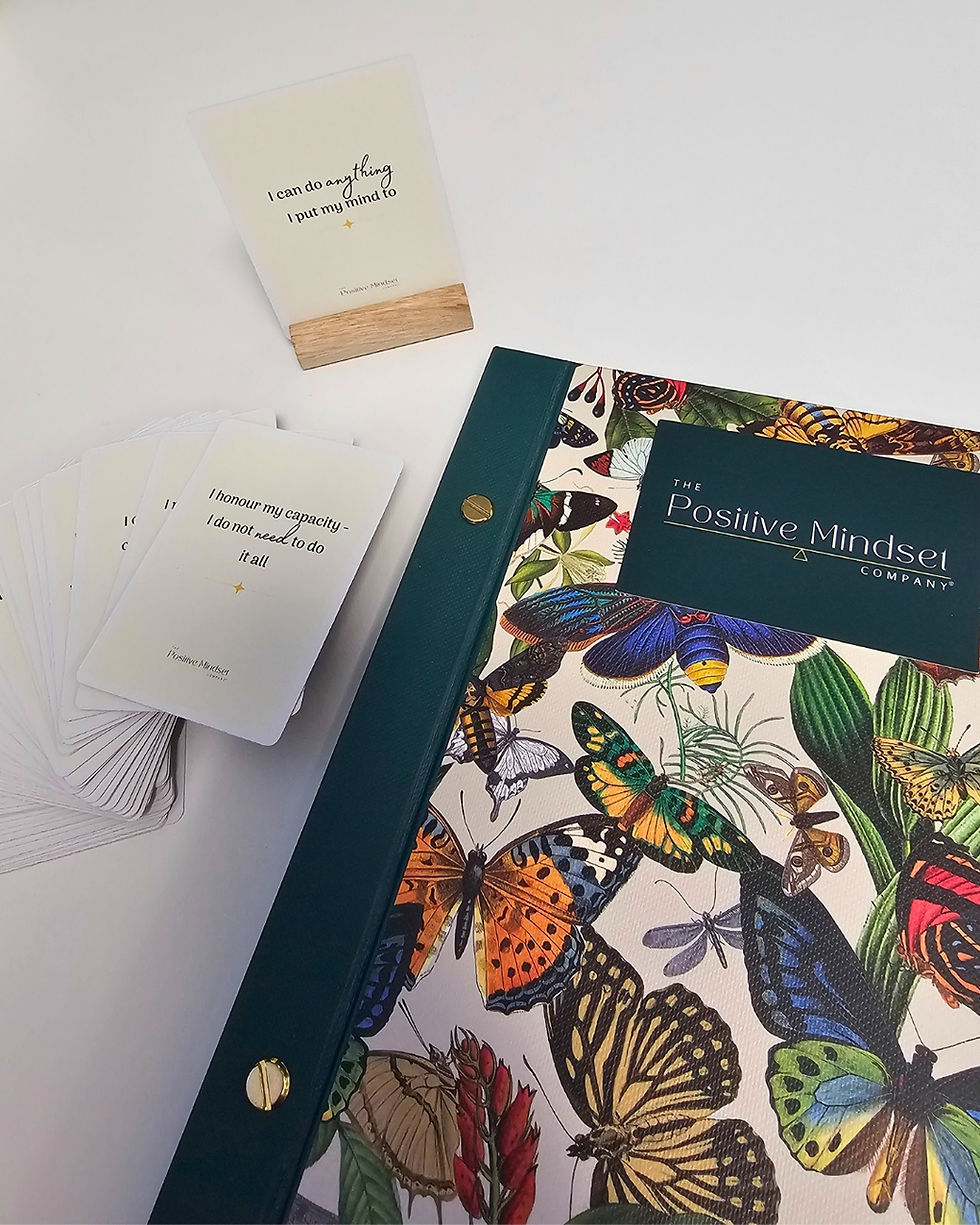 Thumbnail: An affirmation card displayed in a wooden stand with the desk fanned out