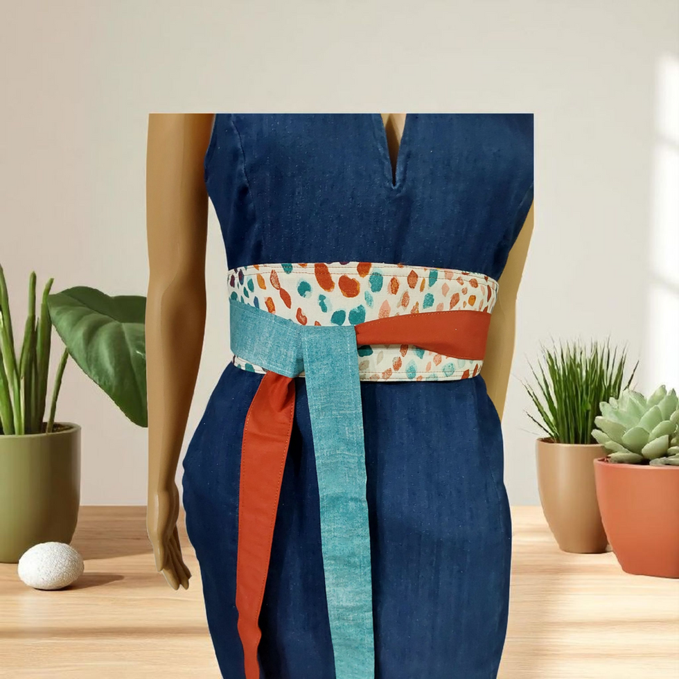 Reversible obi belt with teal and rust color block ties on abstract print