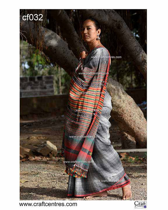 Thumbnail: Woman wearing a gray saree with color lines; bhujodi fine cotton saree. Bhujodi Saree.