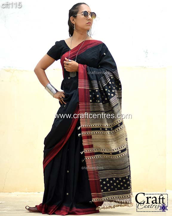 Thumbnail: Woman in black saree with red border, craftcentres.com, Bhujodi Saree
