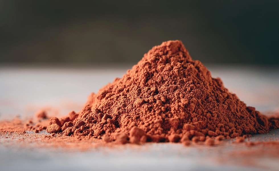 Textured mound of raw French Red Clay used in FEEL NO EVIL soap formulation.