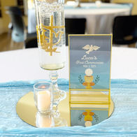 First Communion Centerpieces with blue and gold elements.
