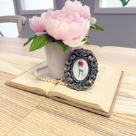 fairytale bridal shower table with red rose and romantic happily ever after decor