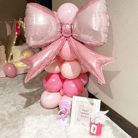 sleepover tents decorated with pink balloons and bow balloon
