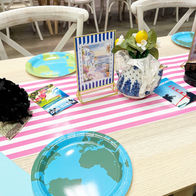 Greece travel-themed party centerpiece with blue and white Mediterranean décor