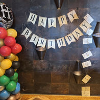 Photo backdrop and birthday sign at the Delafield Hotel