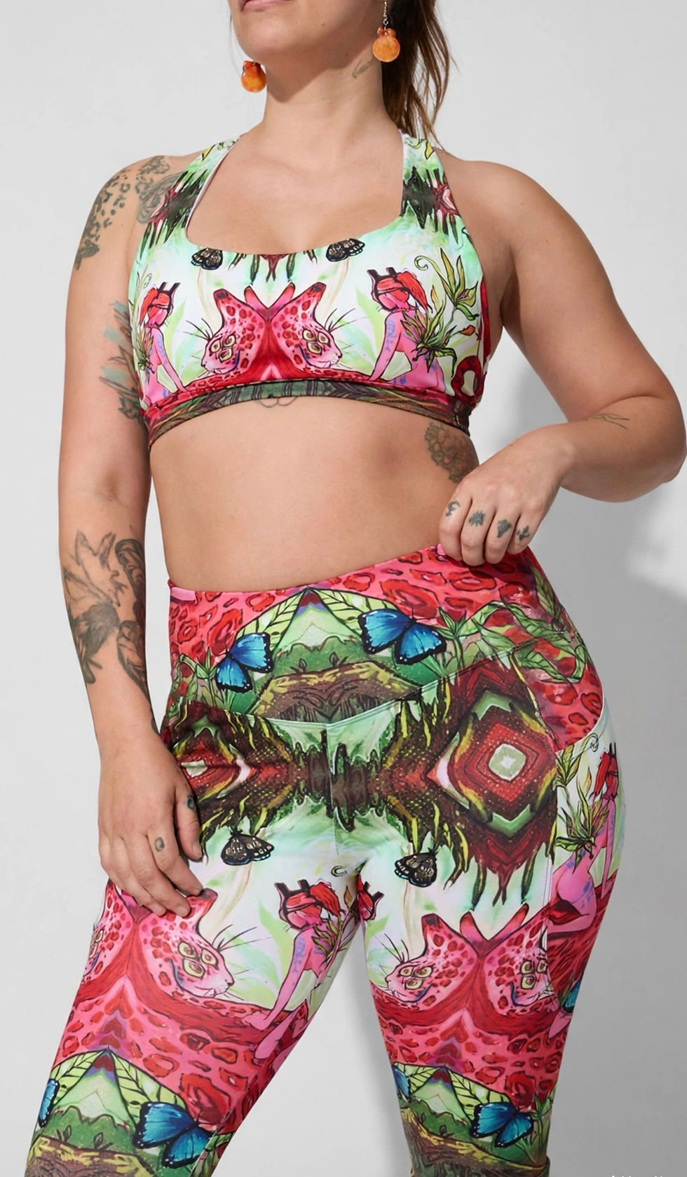 Shop the Jungle Pussy Yoga Top by Isabela Escobar, a psychedelic longline sports bra with original botanical artwork, removab