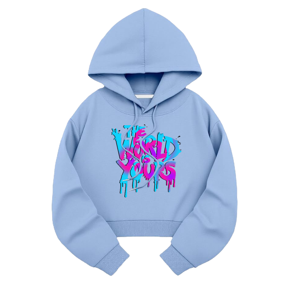 Crop Light Blue Hoodie Front View With the Graphic Design Saying The World Is Yours In Pink And Cyan Color Mix