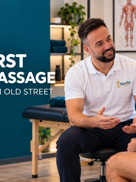 Sports massage therapist discussing a first appointment with a client at Movelia Therapy in Old Street
