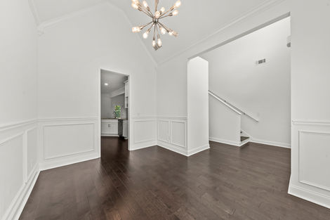 Dining room with chandelier and the staircase beyond