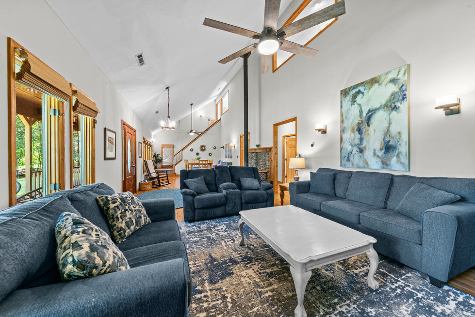 Living room seen from the dining area with the staircase beyond