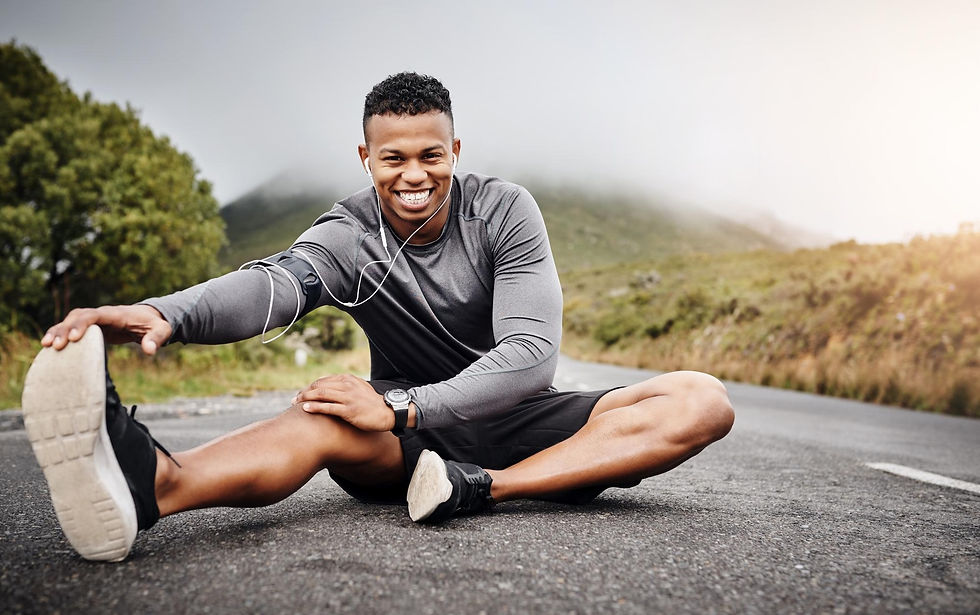 A healthy man, stretching after a long run.