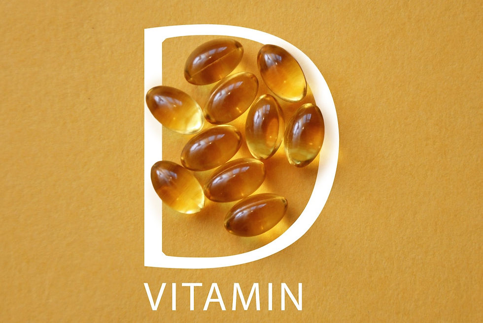 Vitamin D capsules form the letter D on a yellow background, conveying health and nutrition. The word "VITAMIN" is seen below.