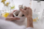 A woman working on product formulations for a skin care company.