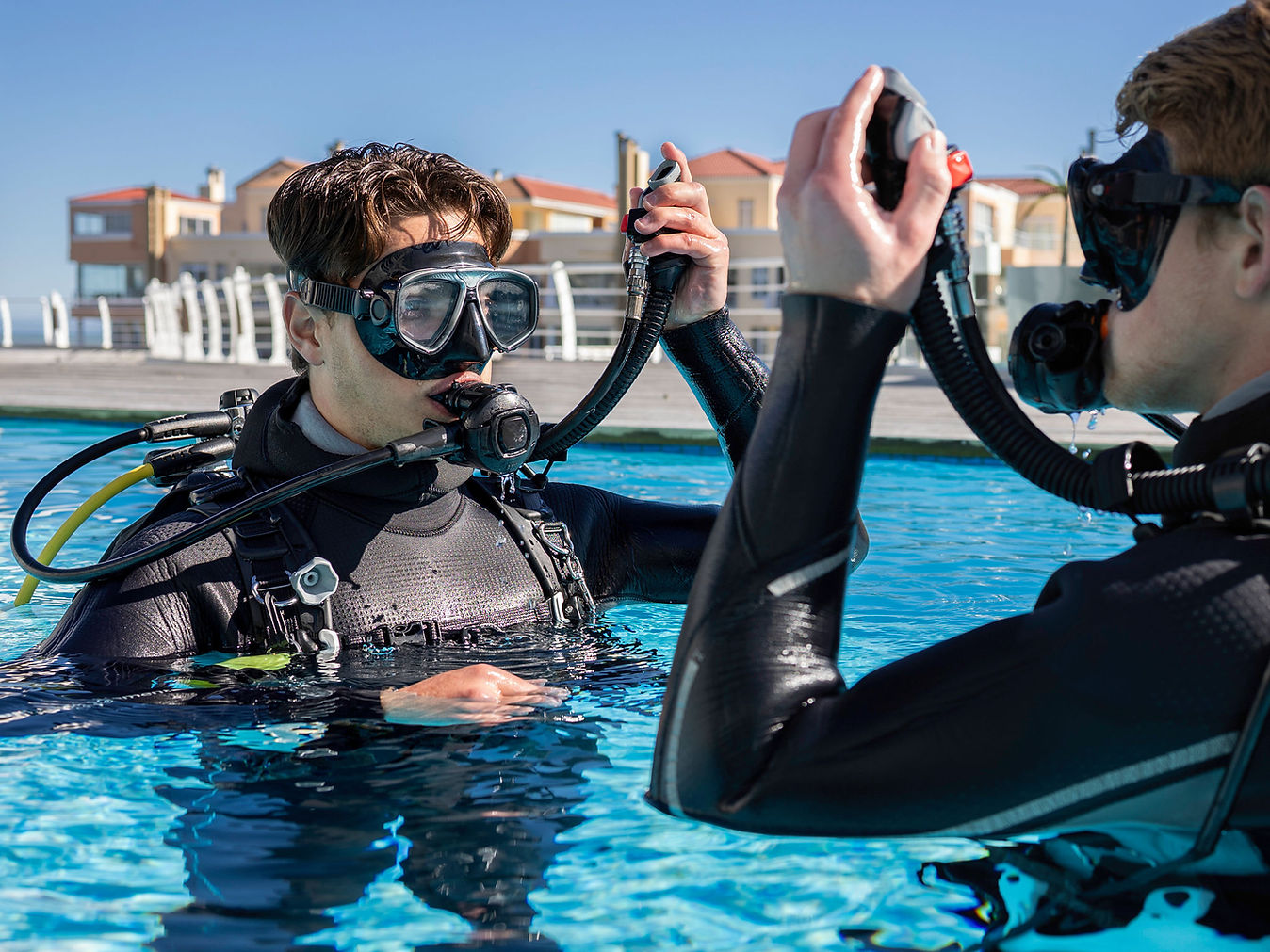 PADI Scuba Refresher course in a Pattaya swimming pool with divers practicing essential safety skills before an ocean dive.