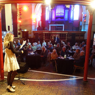 Woman reading story to audience