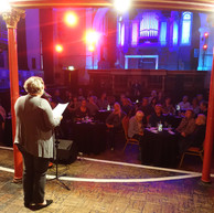 Woman reads to audience