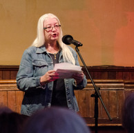 Woman reading story to audience
