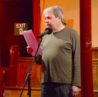 Man reads to audience