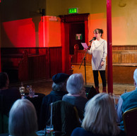 Woman reads to audience