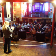 Woman reads to audience