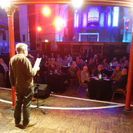Man reads to audience