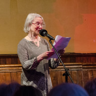 Woman reads to audience