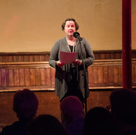 Woman reads to audience