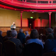 Woman reading story to audience