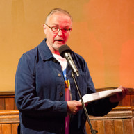 Man reading to audience