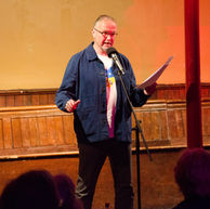 Man reads to audience