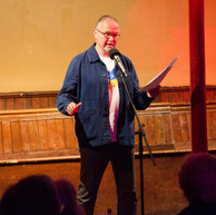 Man reads to audience