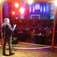 Man reads to audience