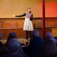 Woman reads to audience