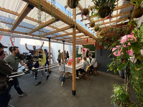 Behind the scenes filming on the Outdoor Patio Set at 2010 Studios Los Angeles with professional lighting and cameras.