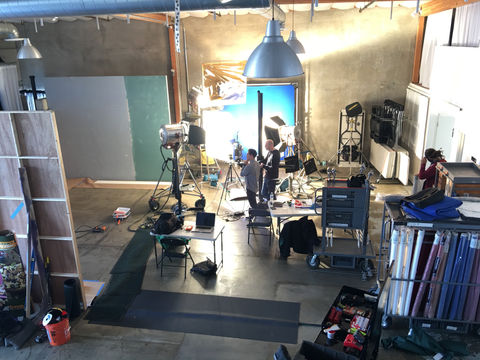 Film crew preparing equipment inside Stage One at 2010 Studios, showing easy ground-level load-in and spacious layout.
