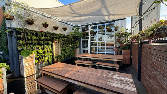 The Outdoor Patio at 2010 Studios is a versatile space that doubles as a filming set and a comfortable lunch area for crews. With a built-in garden and seasonal plants, the patio is ideal for creating outdoor café or garden patio scenes, lifestyle shoots, or bonus social media content. For production needs, the patio also serves as a functional staging or dining area, giving crews a place to relax between takes. Convenient ground-level access and nearby parking make it easy to incorporate the patio into your workflow, whether you’re filming exterior scenes or using it as a crew-friendly lunch space.
