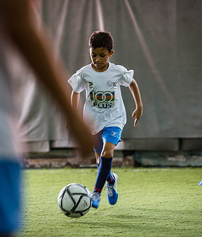 kid-dribbling-ball-training-academy