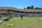A man walks past a building at Matanao National High School, previously damaged by a series of earthquakes in 2019, that collapsed following the magnitude 7.8 quake in Matanao, Davao del Sur, Philippines, June 8, 2026. REUTERS/Manman Dejeto