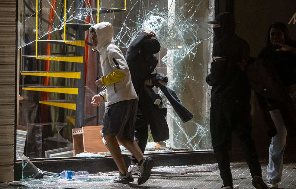 Police arrest 100 in Barcelona after 'anti-system' rioters loot stores, set fires