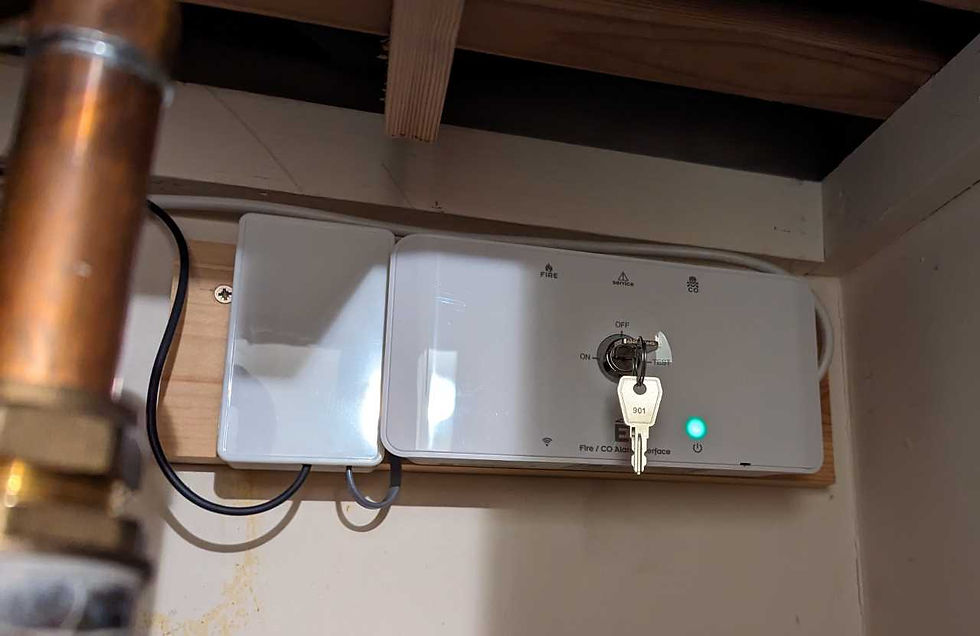 Aico Ei414 Alarm Interface fitted inside a cupboard