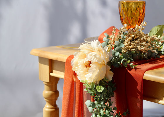 Draping Floral Design on a Burnt Orange Table