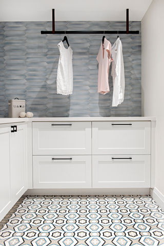 Laundry room with storage designed by Frahm Interiors 