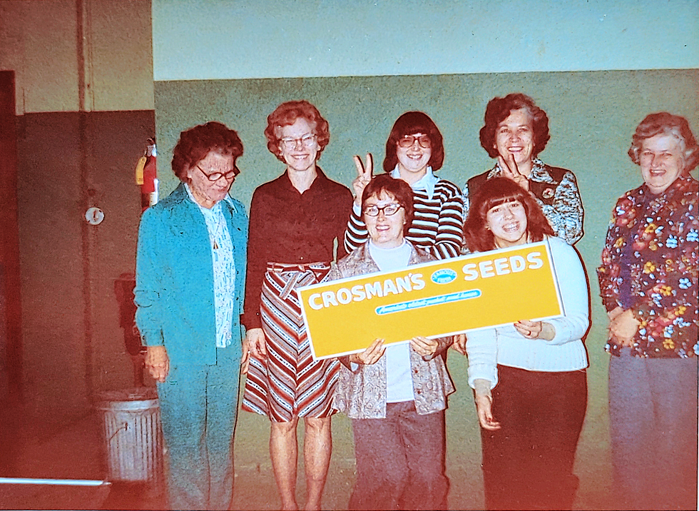 Ladies with Crosman Sign