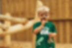 child using magnifying glass in nursery outdoor area