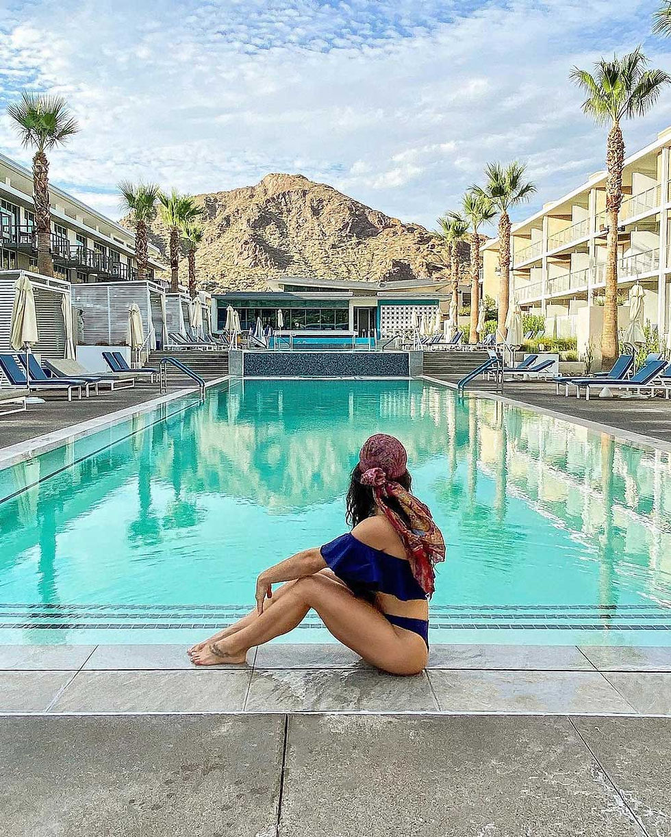 fit healthy woman sitting poolside in phoenix, az